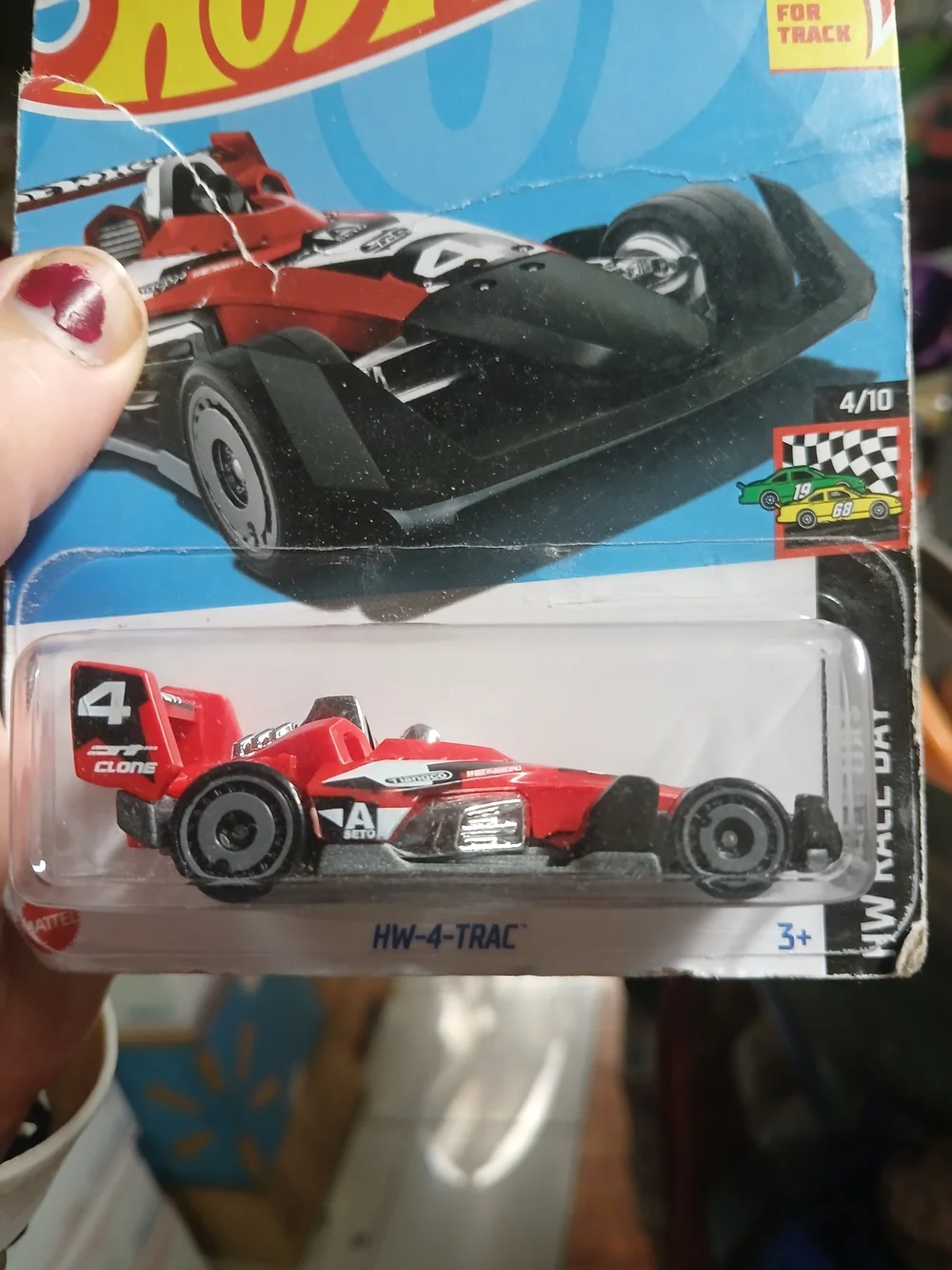 1:64 scale red and black HW-4-TRAC die-cast car from the 2024 Hot Wheels HW Race